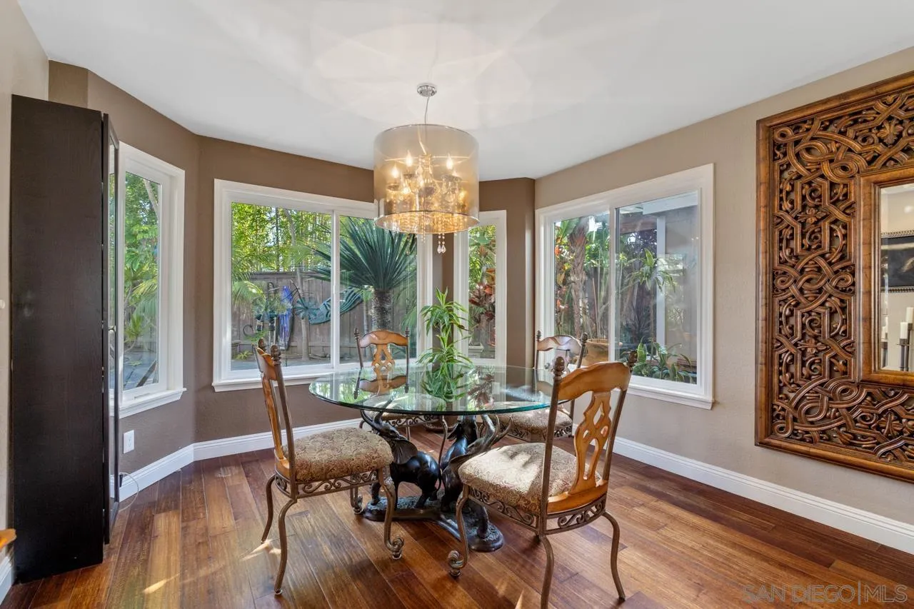 1815 Hawk View Drive Encinitas, CA 92024 - Photo 41 of 51 a view of a dining room with furniture wooden floor and chandelier
