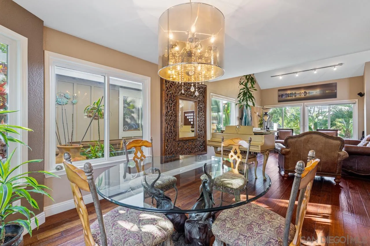 1815 Hawk View Drive Encinitas, CA 92024 - Photo 42 of 51 a view of a dining room with furniture a chandelier and wooden floor