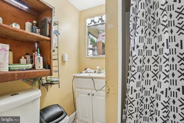 a view of a hallway with dining area and glass door
