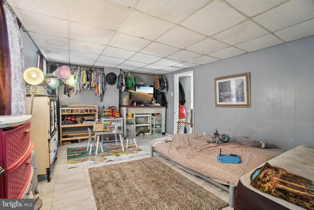 a very nice looking room with a large window and a flat screen tv