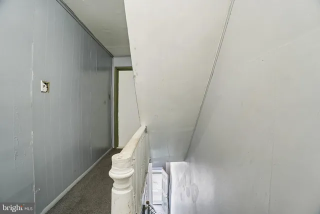 a view of a hallway with white walls