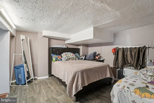 a bedroom with bed and a walk in closet