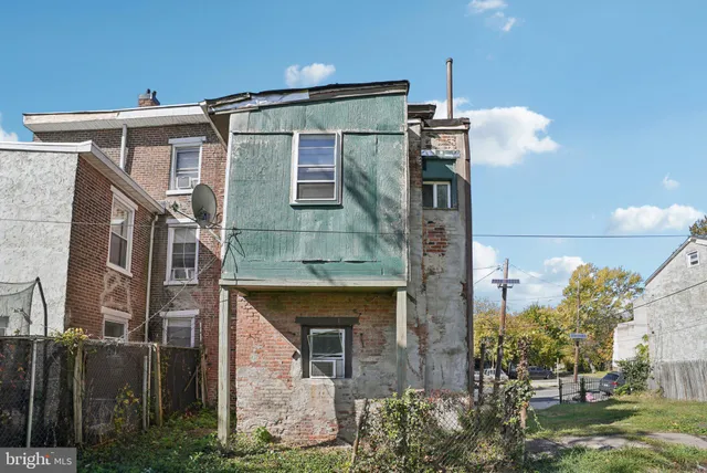 a front view of a house with yard