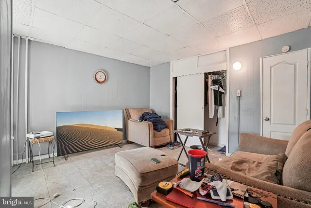 a bedroom with furniture and a wooden floor