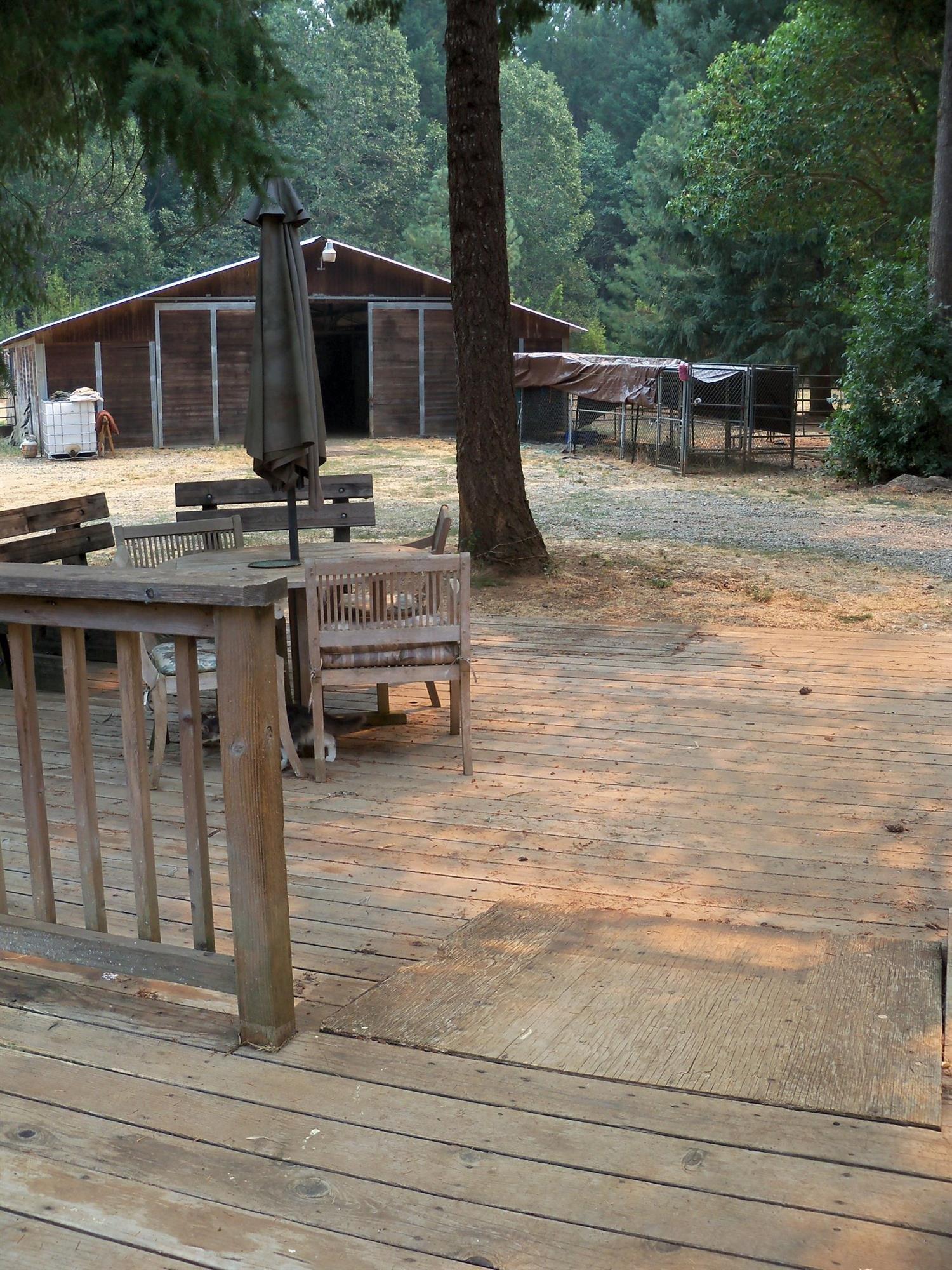 3615 Dick George Road Cave Junction, OR 97523 - Photo 13 of 24 Split level deck wraps around the side o