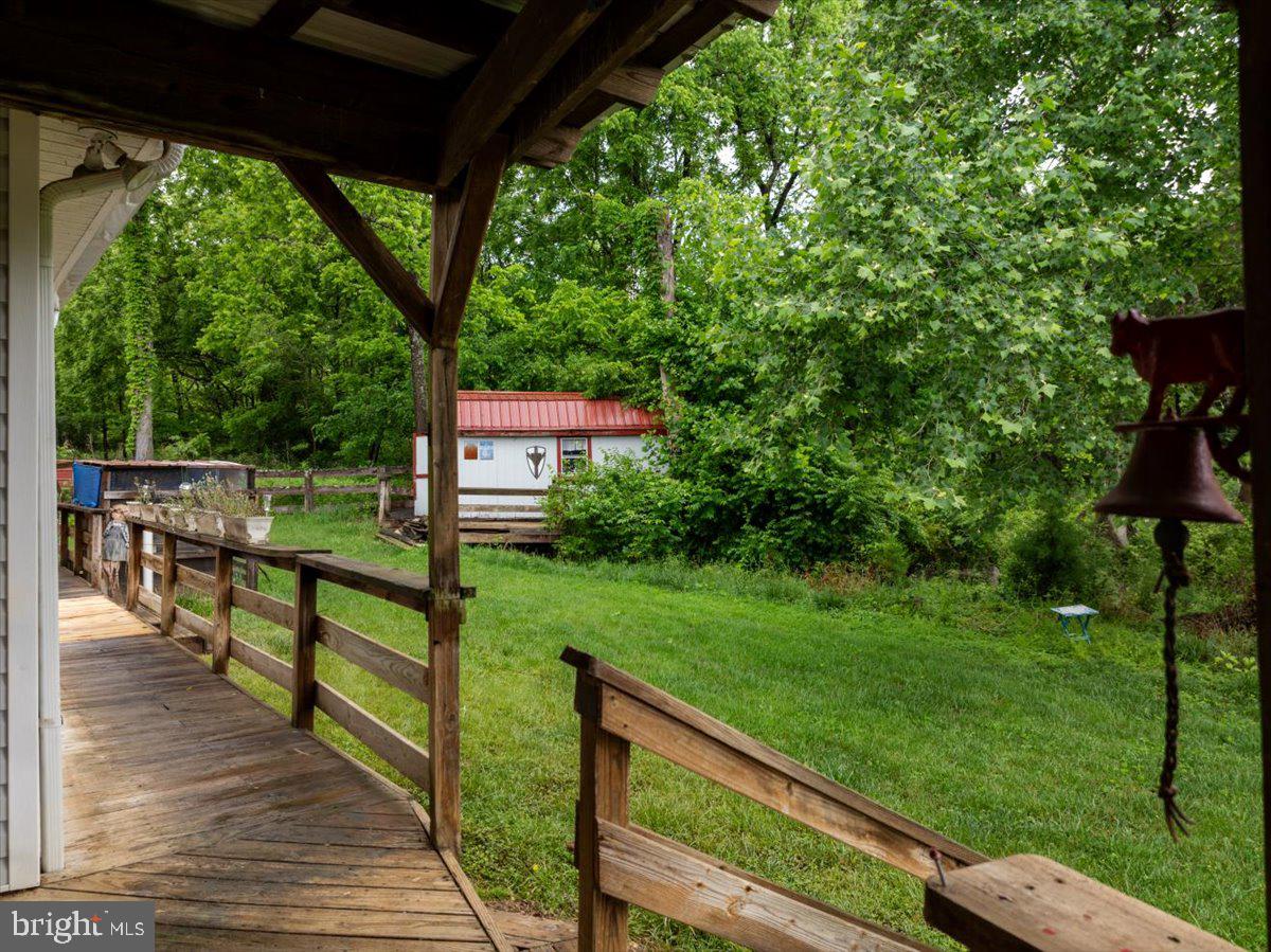 11419 Oak Grove Road Bristol, VA 24202 - Photo 36 of 36 a view of a wooden deck and a yard