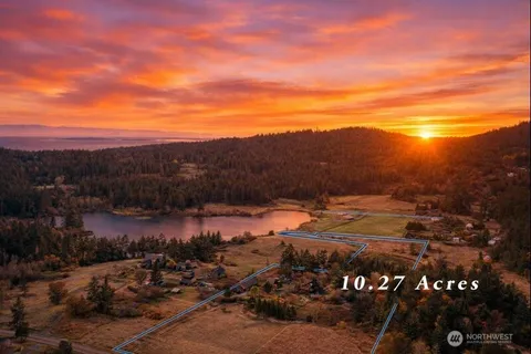 a view of a street with an ocean