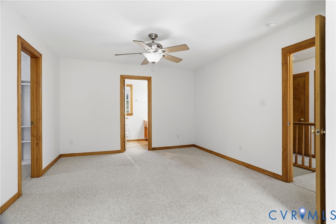 14420 Branding Iron Road Chesterfield, VA 23838 - Photo 23 of 50 Carpeted room with white walls and natural wood tr