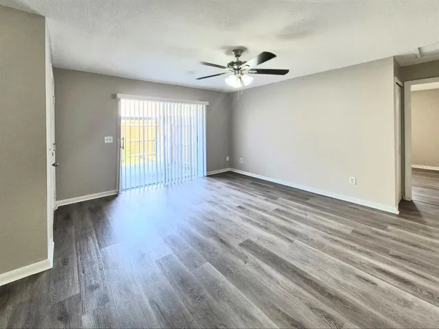 a view of a kitchen with a sink and cabinets