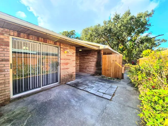 a view of a backyard of the house