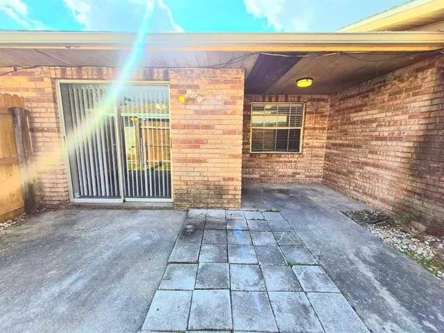 a view of backyard with wooden fence