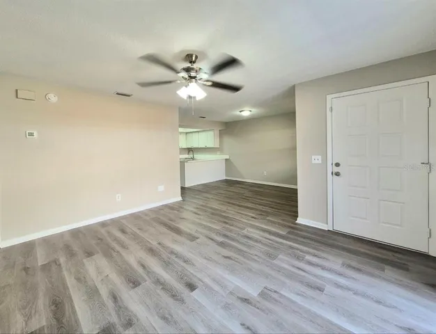 a view of kitchen with wooden floor
