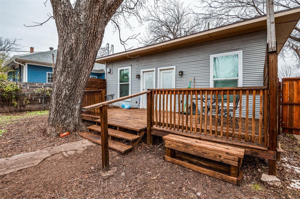 617 Haines Avenue Dallas, TX 75208 - Photo 5 of 29 a view of a wooden bench sitting in backyard