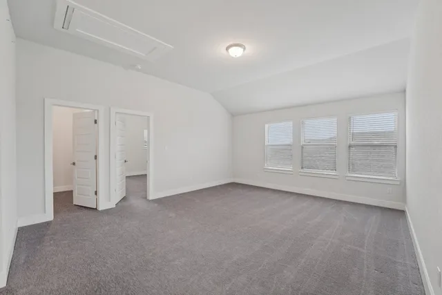 an empty room with a empty space and windows