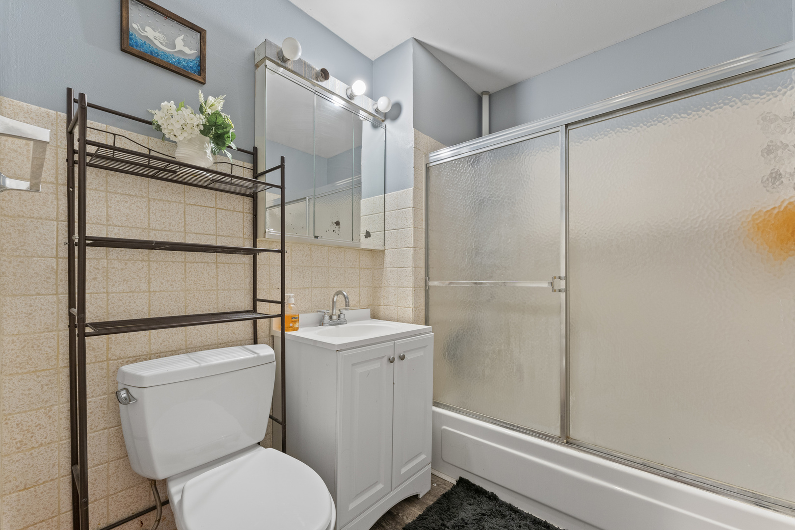 2504 West Algonquin Road, Unit 14 Rolling Meadows, IL 60008 - Photo 13 of 20 a bathroom with a toilet a sink and shower