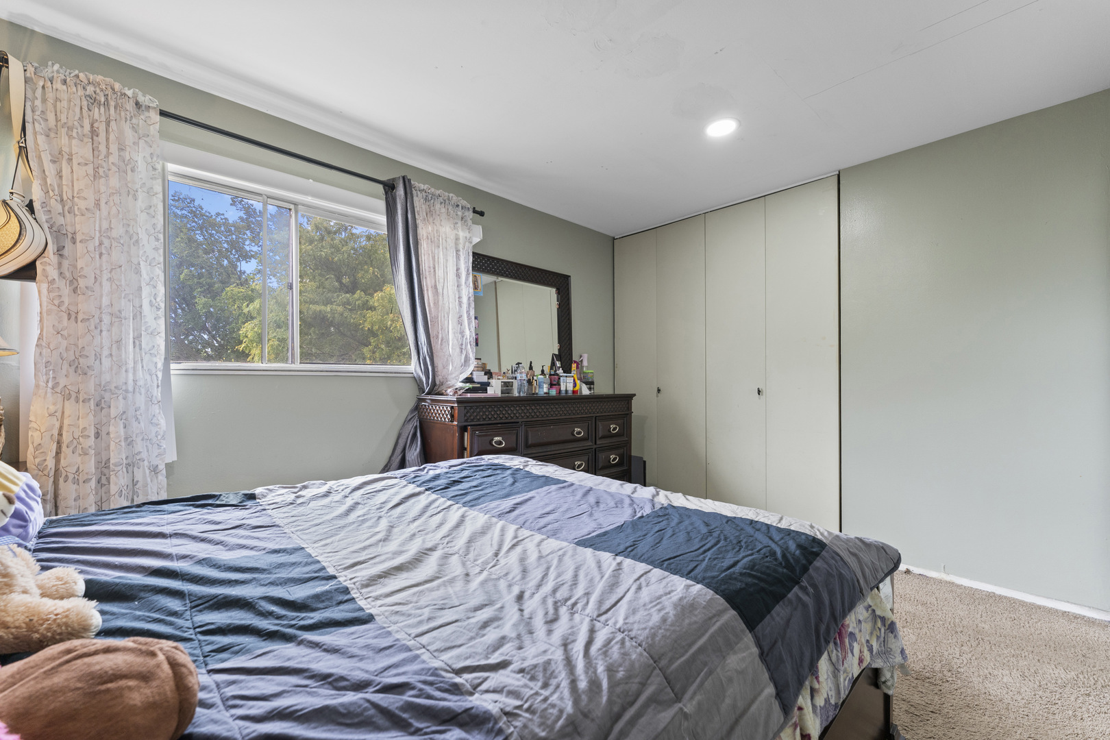 2504 West Algonquin Road, Unit 14 Rolling Meadows, IL 60008 - Photo 14 of 20 a bedroom with a bed and a large window
