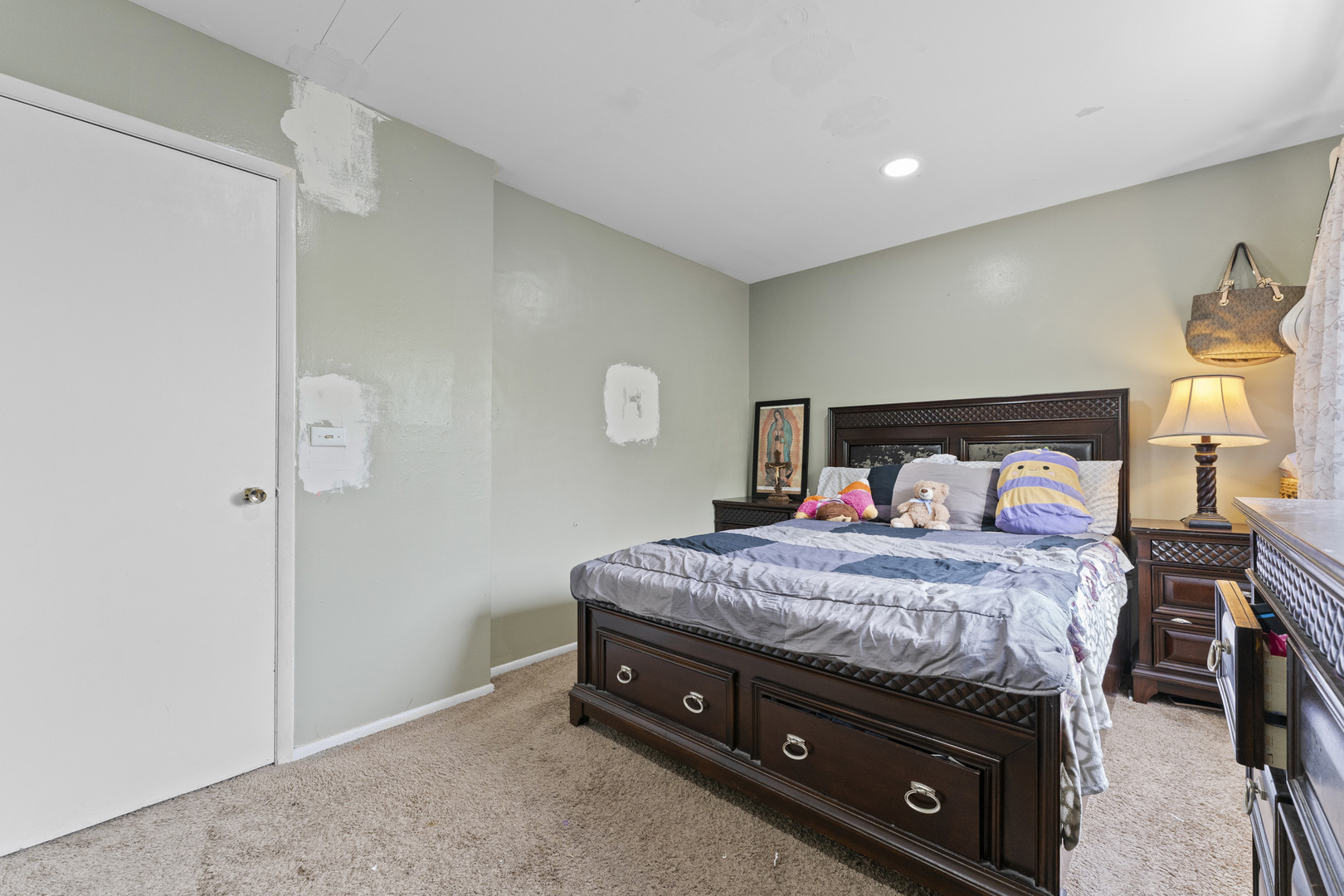 2504 West Algonquin Road, Unit 14 Rolling Meadows, IL 60008 - Photo 15 of 20 a bedroom with a bed and a dresser