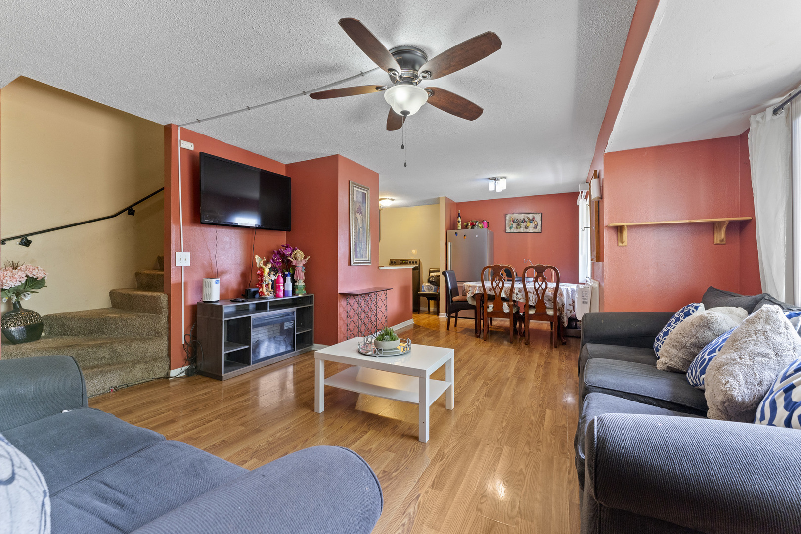 2504 West Algonquin Road, Unit 14 Rolling Meadows, IL 60008 - Photo 5 of 20 a living room with furniture and a flat screen tv