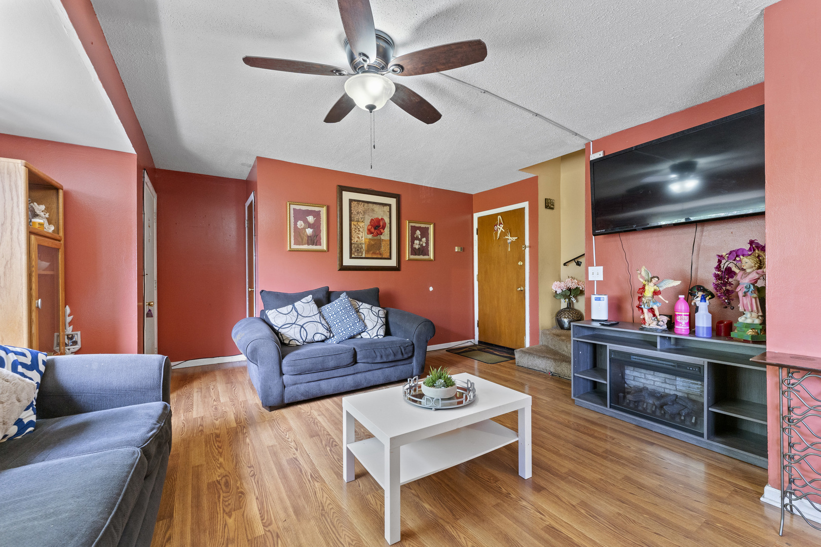 2504 West Algonquin Road, Unit 14 Rolling Meadows, IL 60008 - Photo 7 of 20 a living room with furniture and a flat screen tv