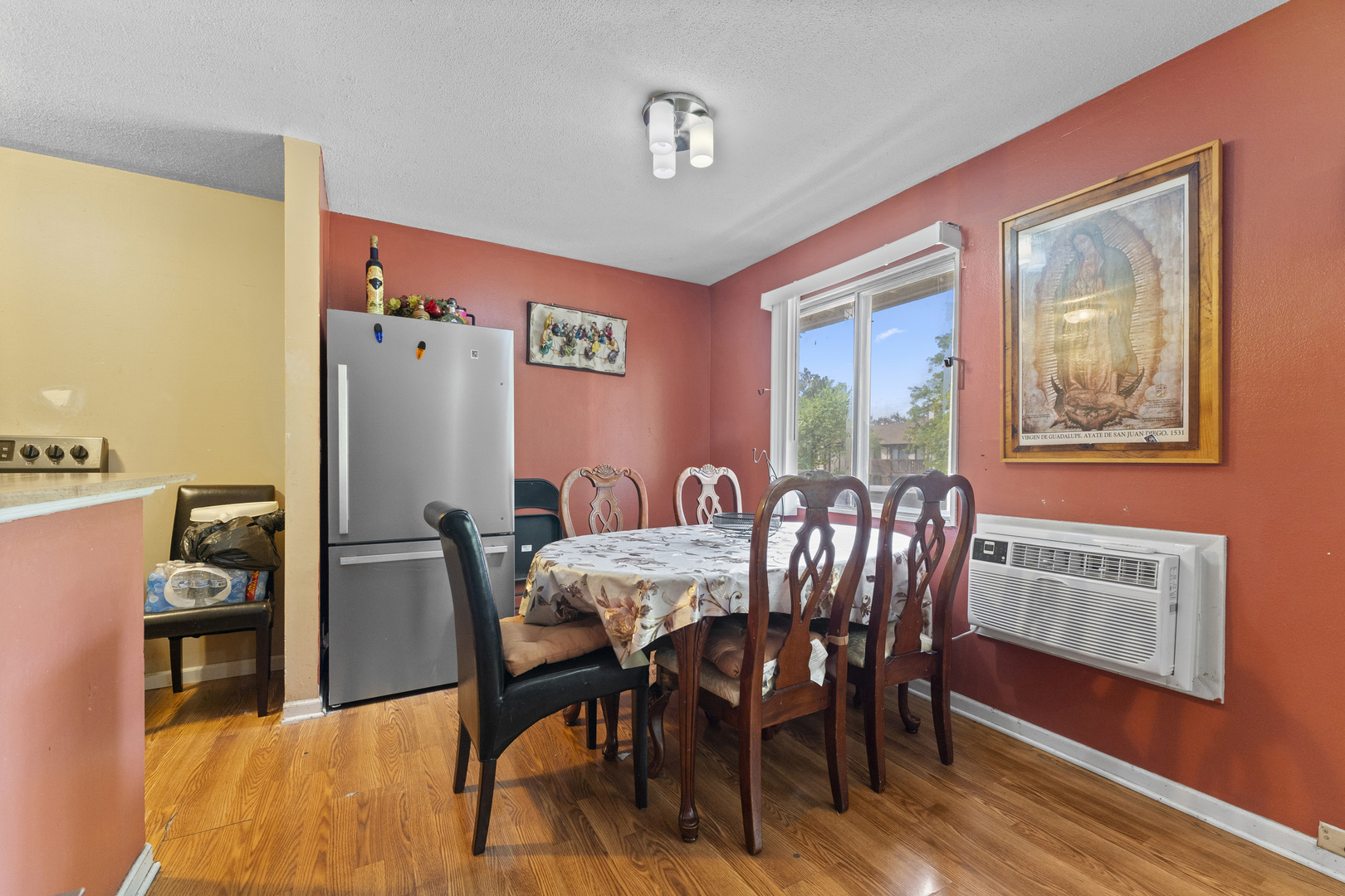 2504 West Algonquin Road, Unit 14 Rolling Meadows, IL 60008 - Photo 8 of 20 a view of a dining room with furniture window and wooden floor
