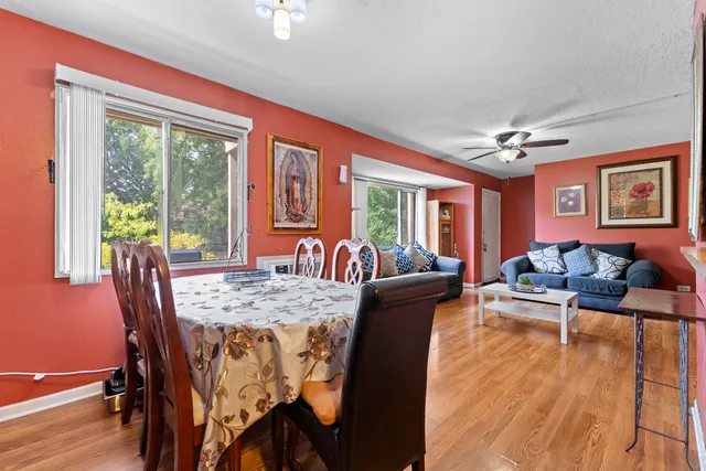 a view of a dining room with furniture window and wooden floor