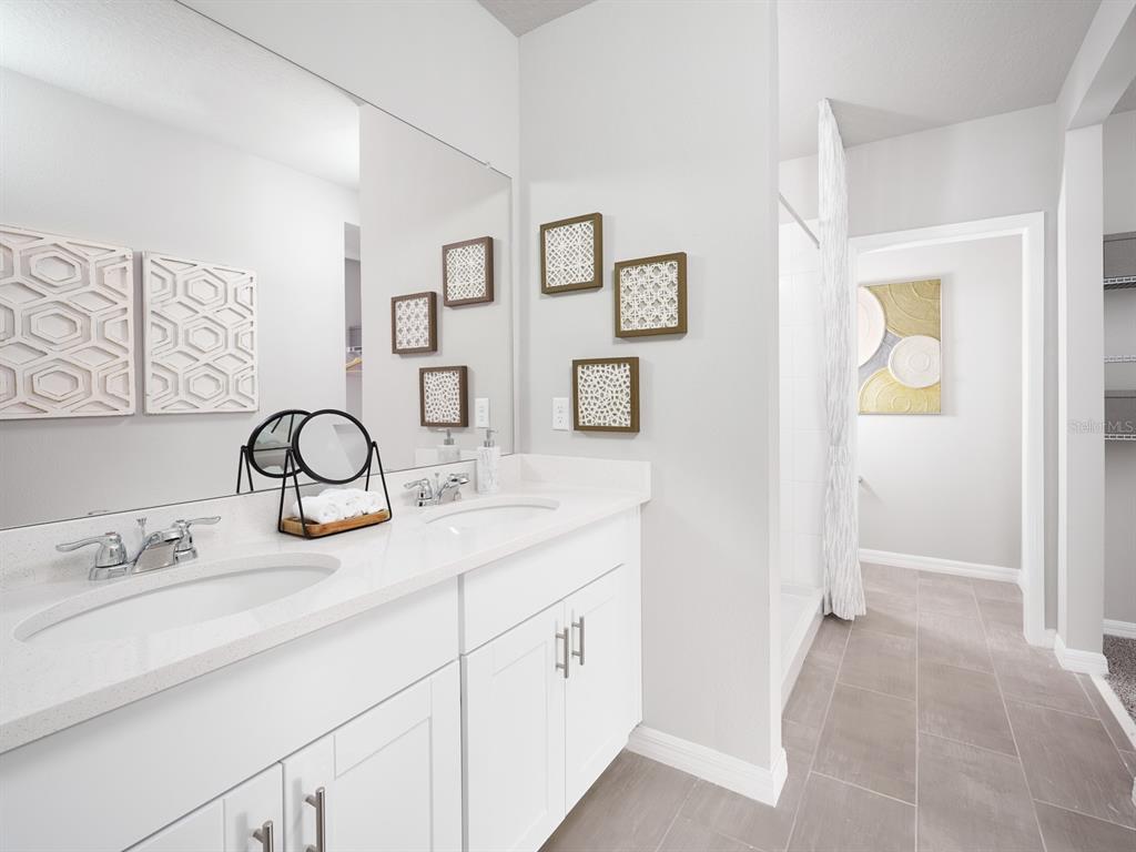 44505 Diamond Trail Punta Gorda, FL 33982 - Photo 5 of 7 a bathroom with a granite countertop sink and a mirror