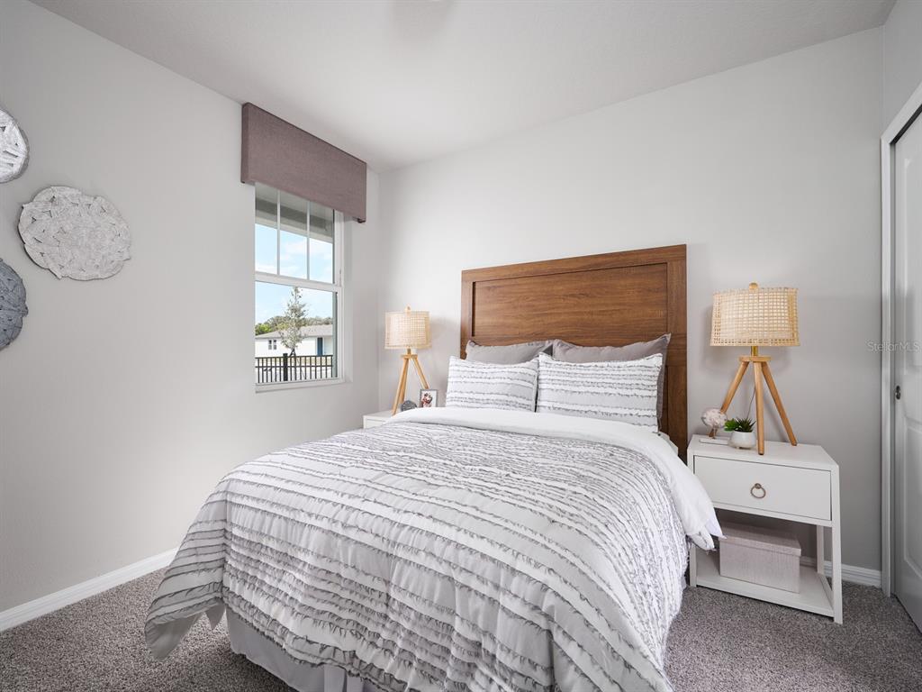 44505 Diamond Trail Punta Gorda, FL 33982 - Photo 7 of 7 a bedroom with a bed and a lamp on table