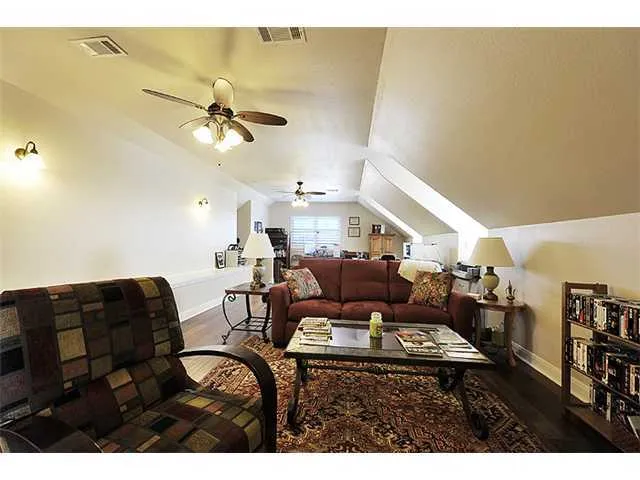 a bathroom with a sink double vanity granite tub shower and a mirror