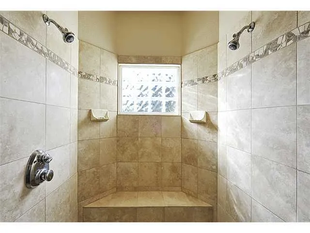 a bedroom with bed and window