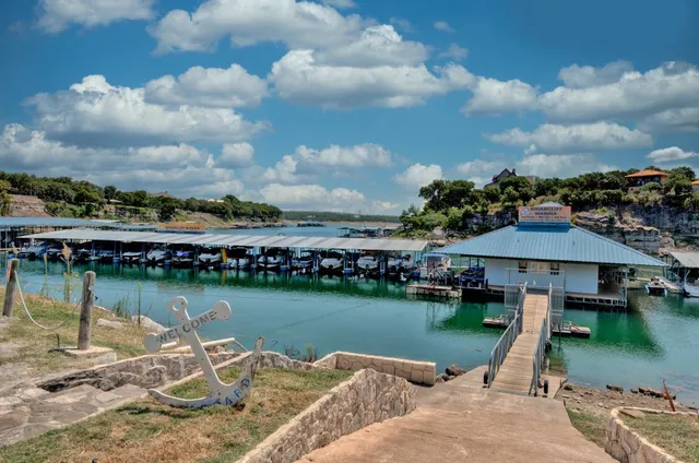 a street sign on a sidewalk next to a road