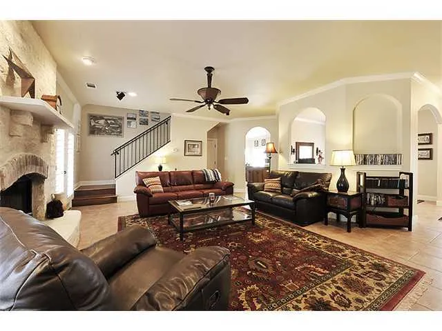 a living room with furniture and a fireplace