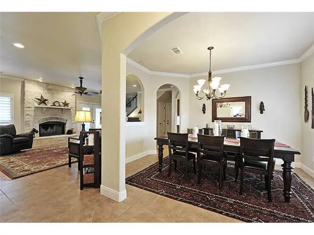 a kitchen with stainless steel appliances granite countertop a sink refrigerator and cabinets