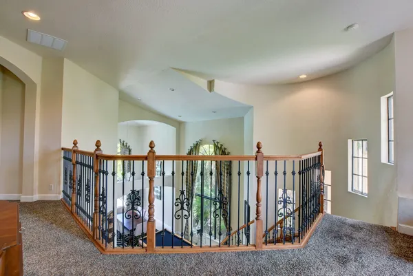 a view of hallway with wooden floor