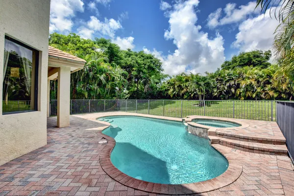 a view of a swimming pool with a sitting space
