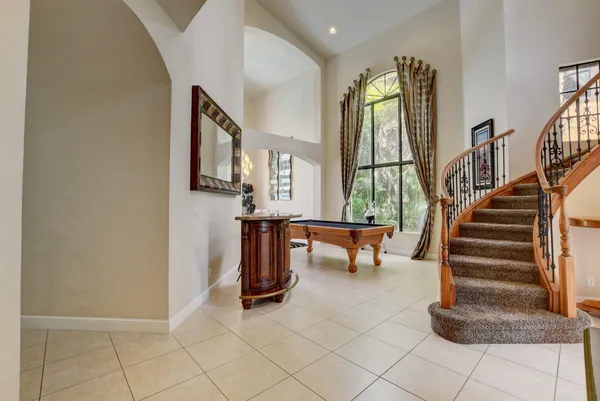 a view of entryway and hall with a mirror