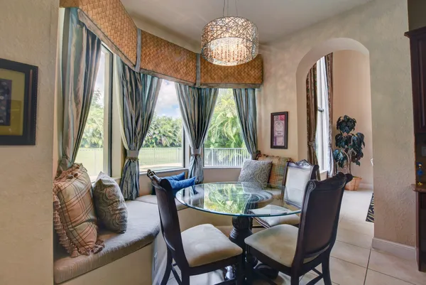 a view of a dining room with furniture window and outside view