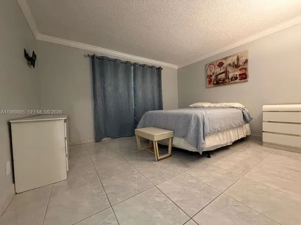a bedroom with a bed and a table in it