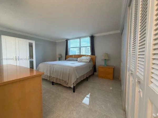a bedroom with a bed and a cabinets