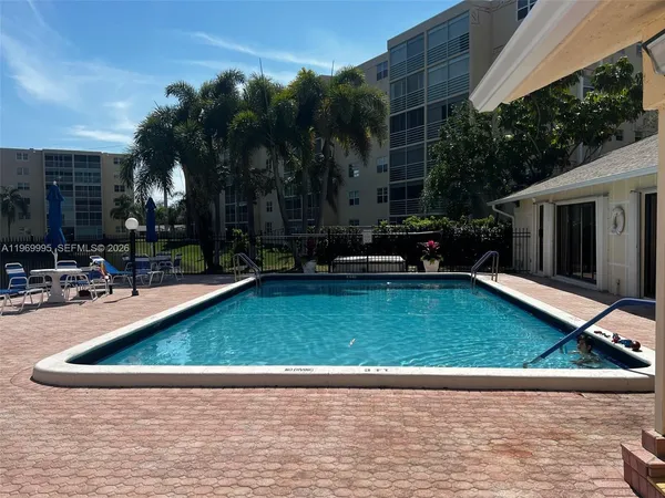 a view of a backyard with a patio