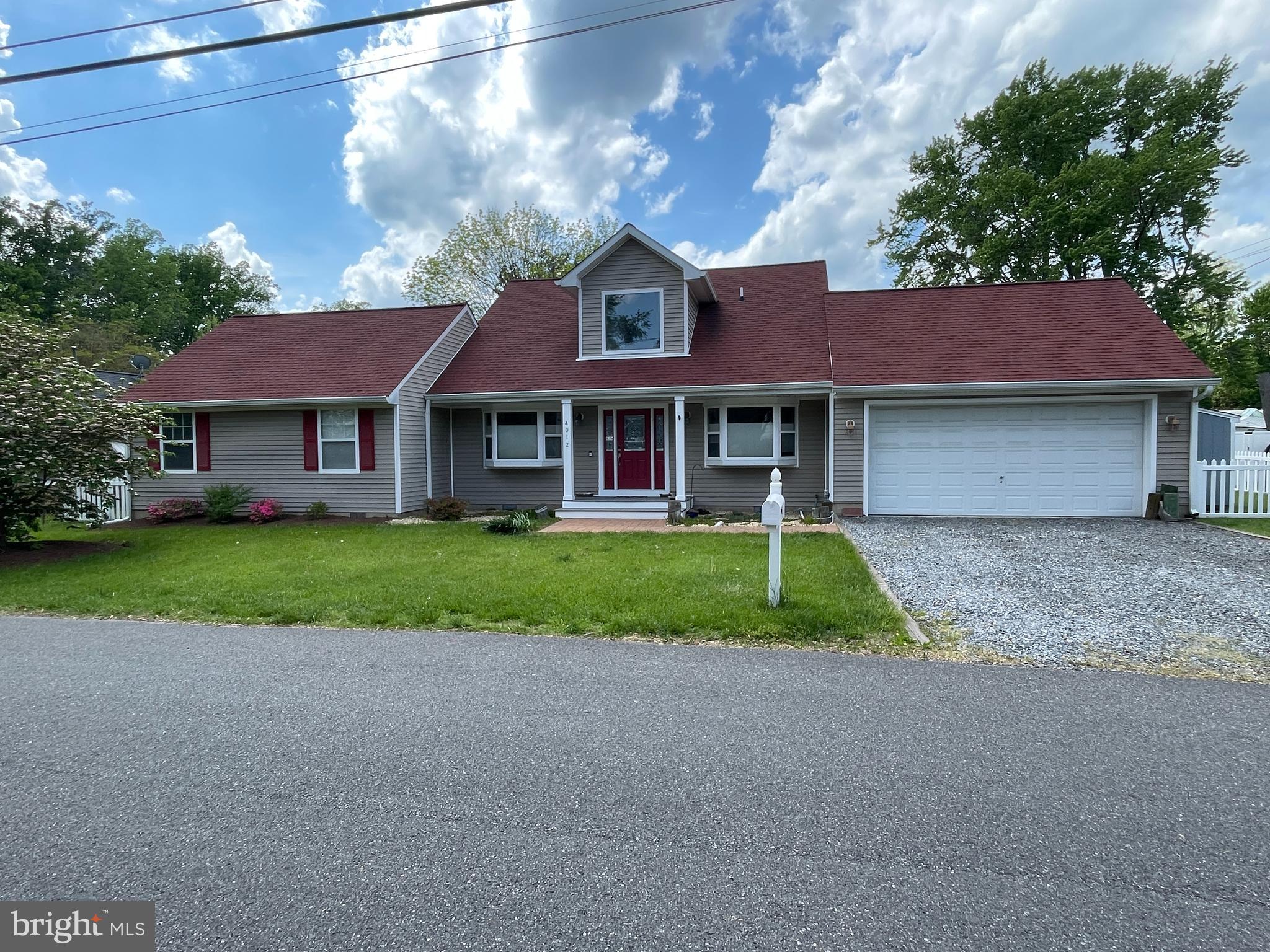 4012 Ramsey Drive Edgewater, MD 21037 - Photo 1 of 77 a house that has a tree in front of it