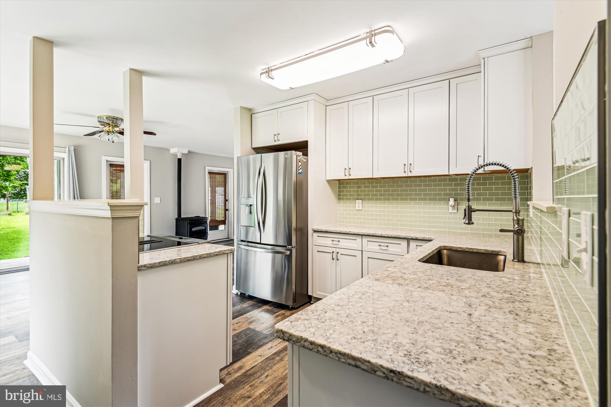 4012 Ramsey Drive Edgewater, MD 21037 - Photo 12 of 77 a kitchen with refrigerator cabinets and wooden floor