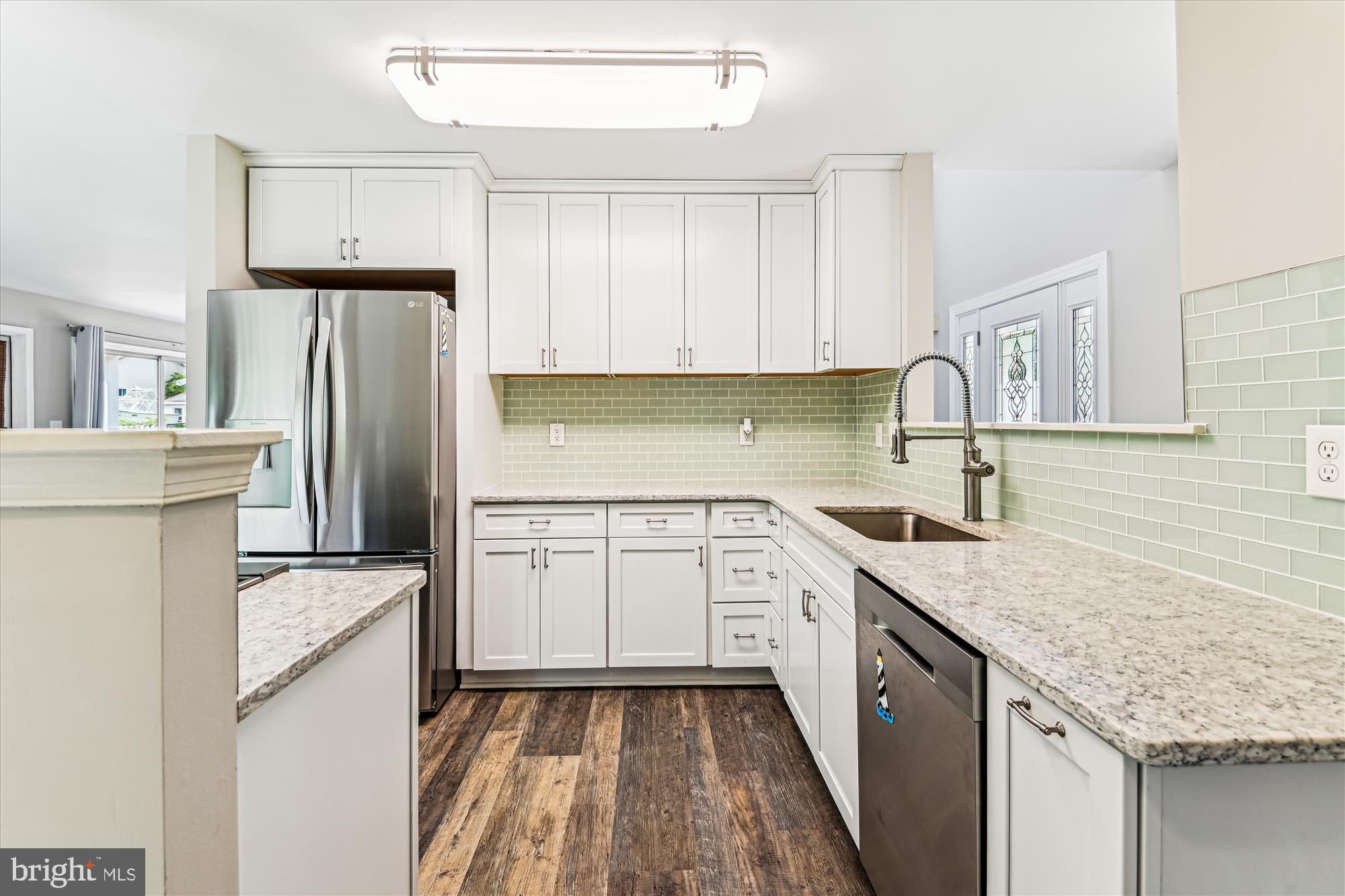 4012 Ramsey Drive Edgewater, MD 21037 - Photo 13 of 77 a kitchen with granite countertop a sink stove refrigerator and cabinets
