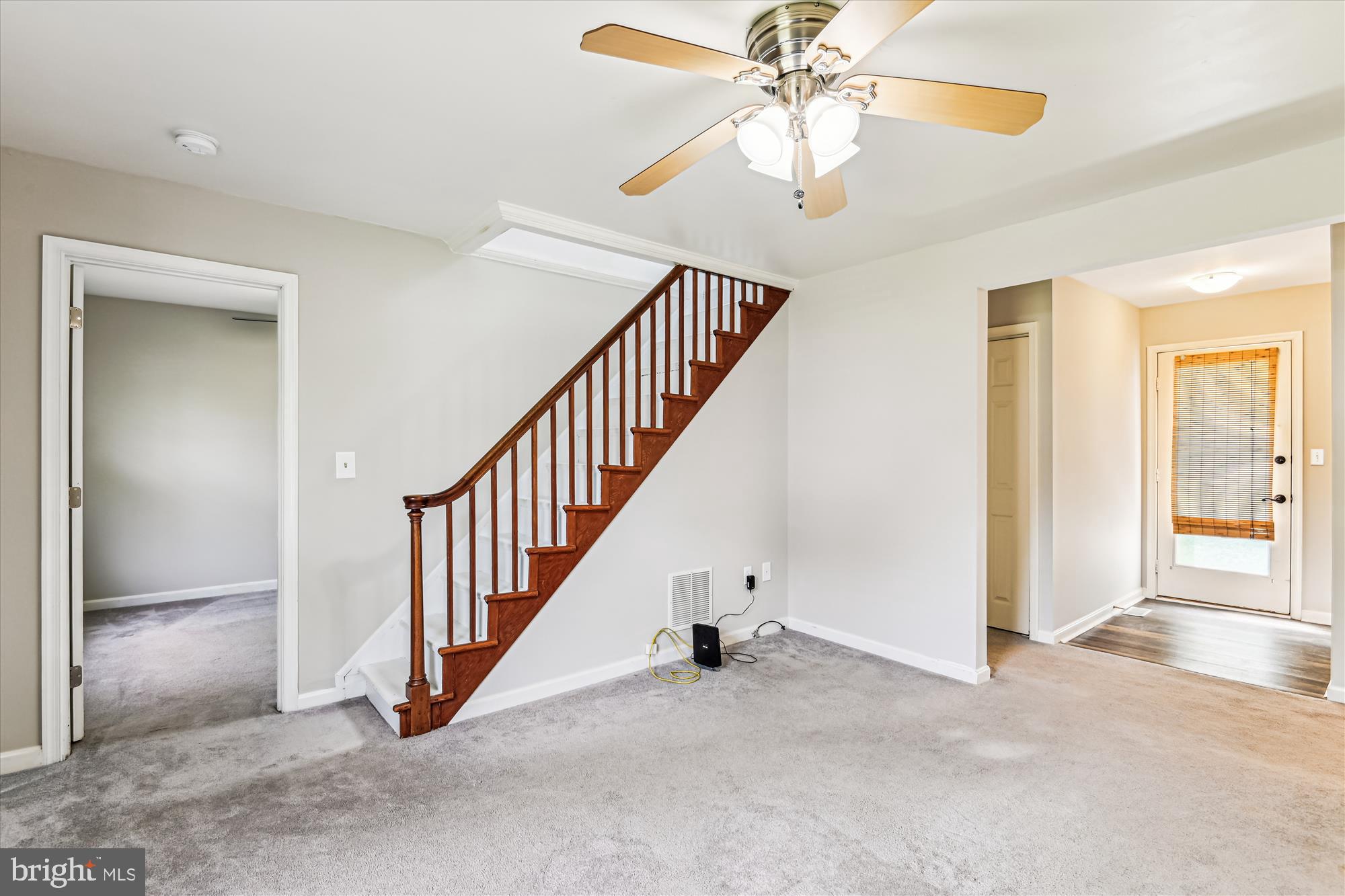 4012 Ramsey Drive Edgewater, MD 21037 - Photo 17 of 77 a view of an empty room with a chandelier fan
