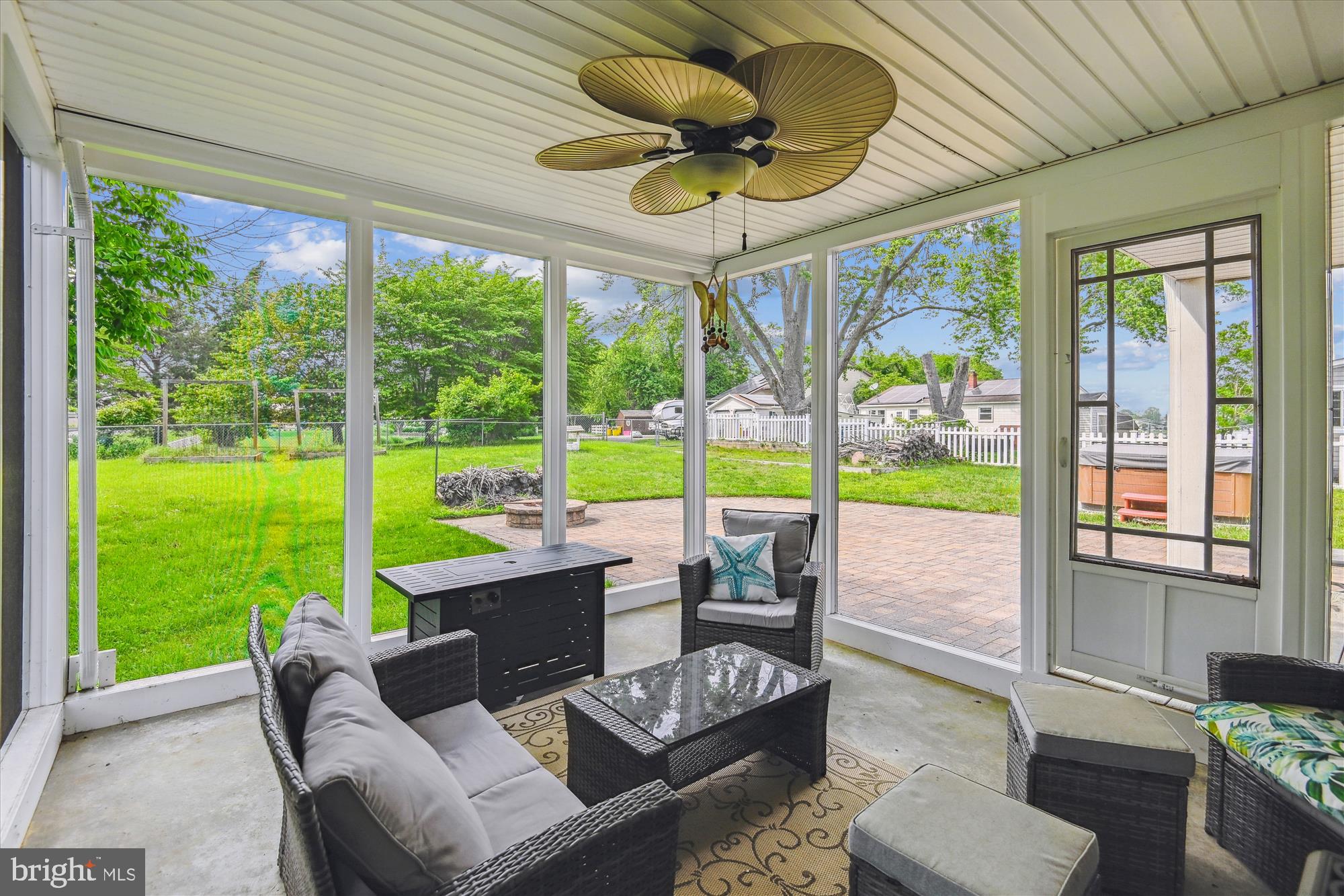 4012 Ramsey Drive Edgewater, MD 21037 - Photo 19 of 77 a living room with patio furniture and a floor to ceiling window
