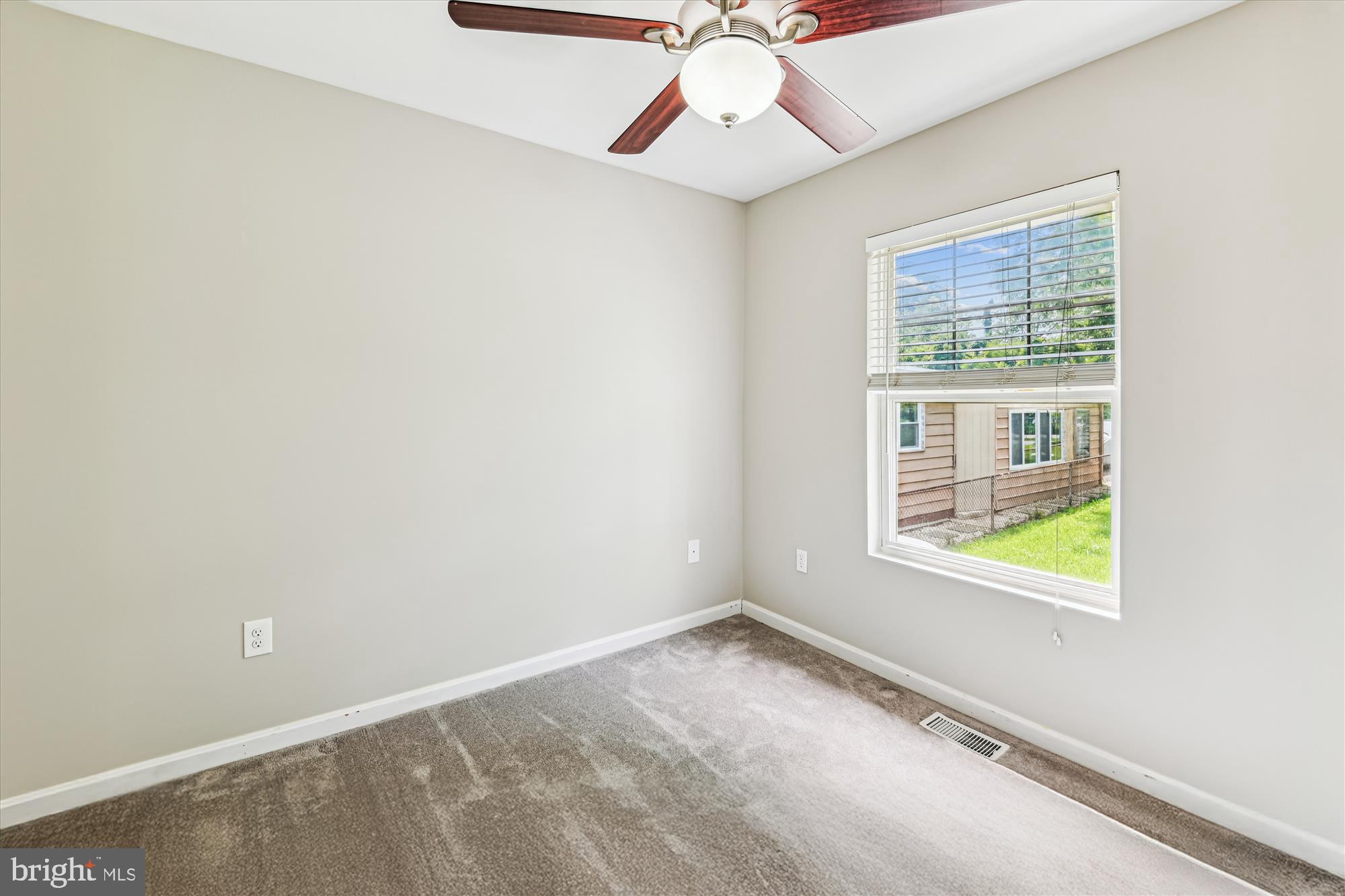4012 Ramsey Drive Edgewater, MD 21037 - Photo 34 of 77 an empty room with a window and a fan