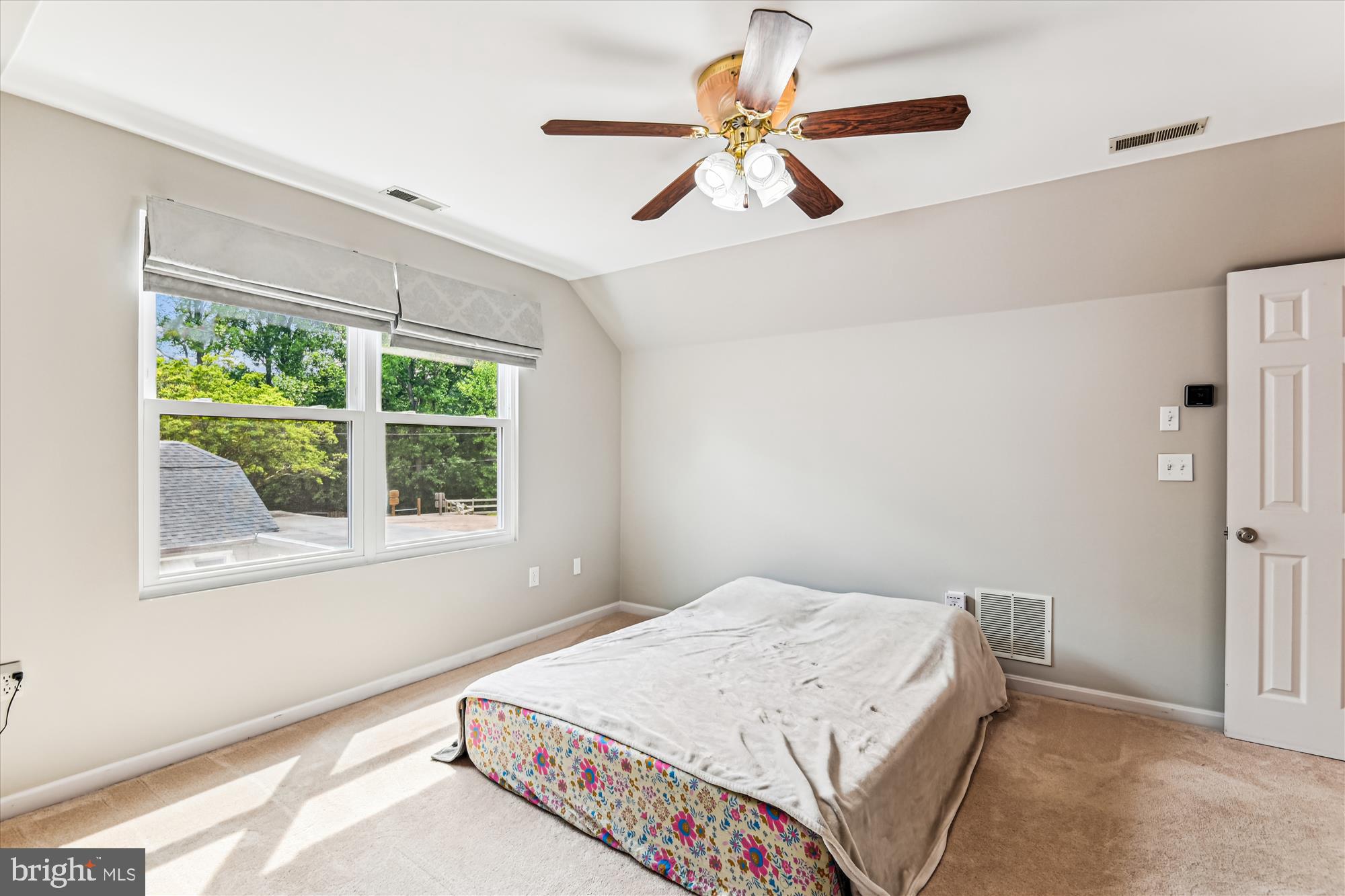 4012 Ramsey Drive Edgewater, MD 21037 - Photo 46 of 77 a bedroom with a bed a window and a chandelier