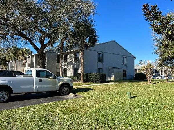 a view of a car parked in front of a house