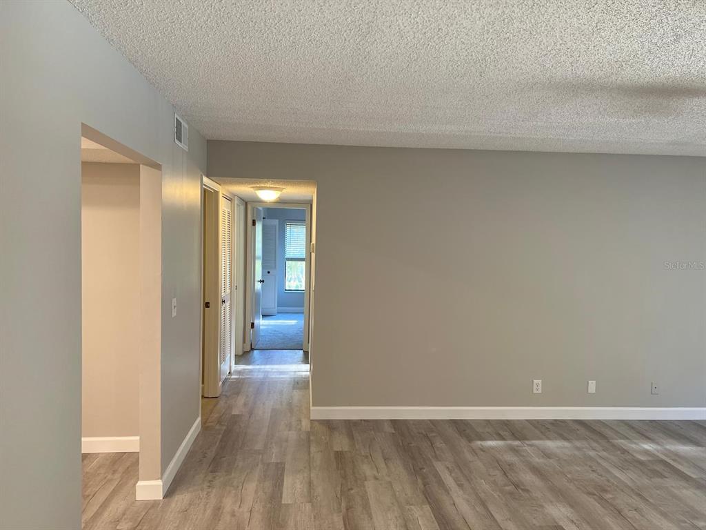 1324 South Pine Ridge Circle, Unit D2 Sanford, FL 32773 - Photo 8 of 15 a view of a room with wooden floor and a bathroom