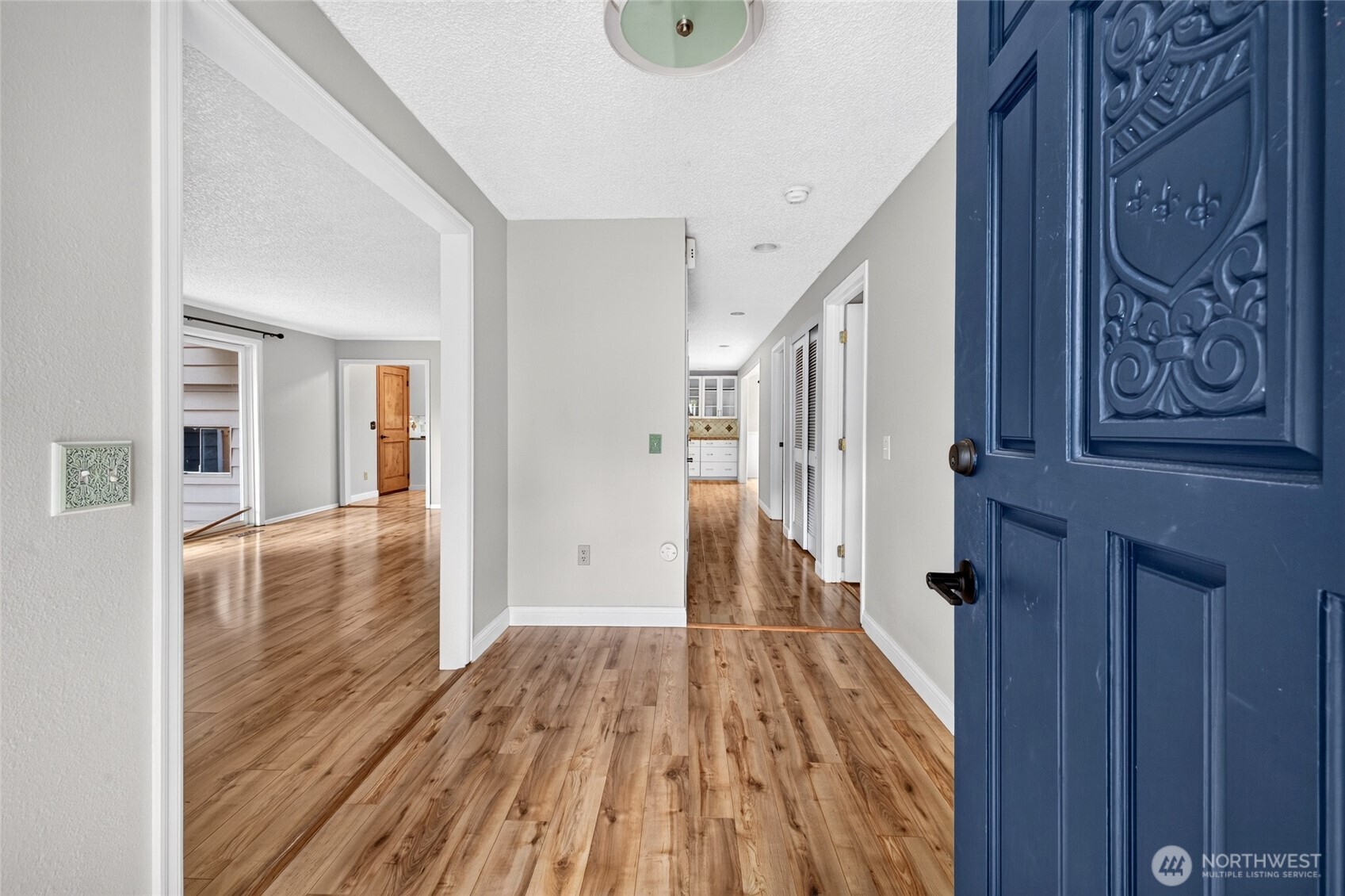 6502 Avondale Road Southwest, Unit 4 Lakewood, WA 98499 - Photo 4 of 34 a view of a hallway with wooden floor and staircase