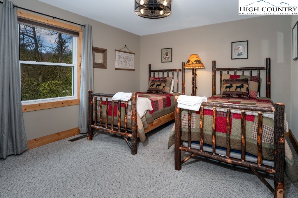 25 Red Oak Road Newland, NC 28657 - Photo 42 of 45 a bedroom with a bed and a window